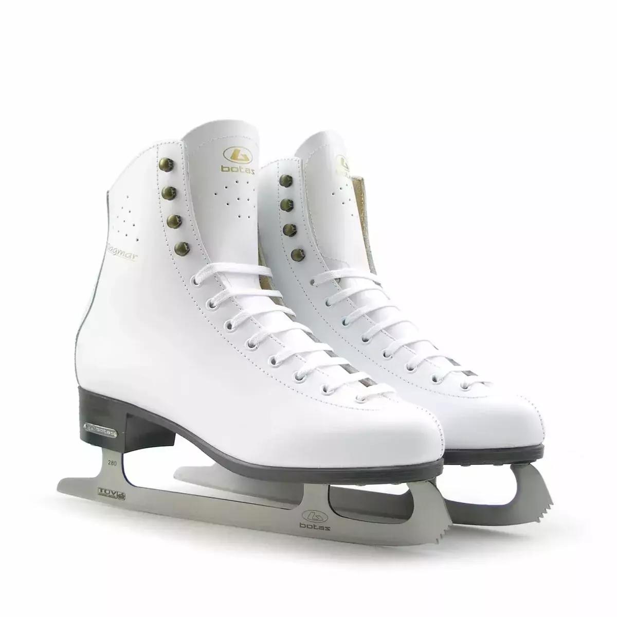 BOTAS Dagmar VERTIGO Women’s and Girls’ Figure Skates 4 Two white BOTAS Dagmar VERTIGO figure skates with botas logos on the tongues and antique-brass lace hooks