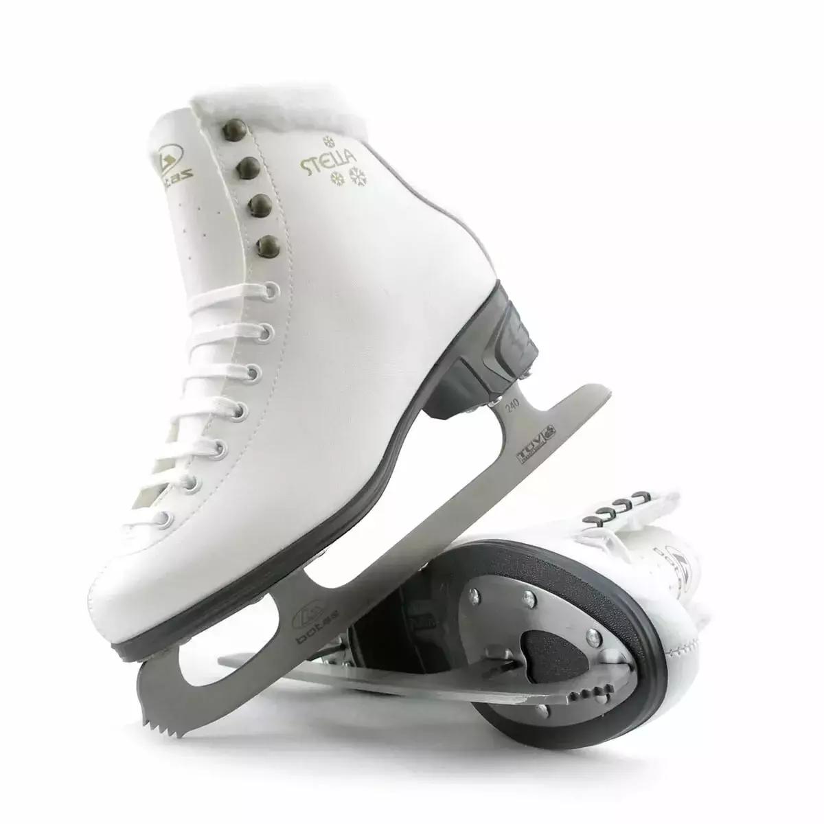 Botas Stella Sport skates, one resting on the graphite sole showing the blade mounting