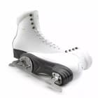Botas Diana figure skates, one boot lying on its side to show the graphite plastic sole and screw-mounted blade