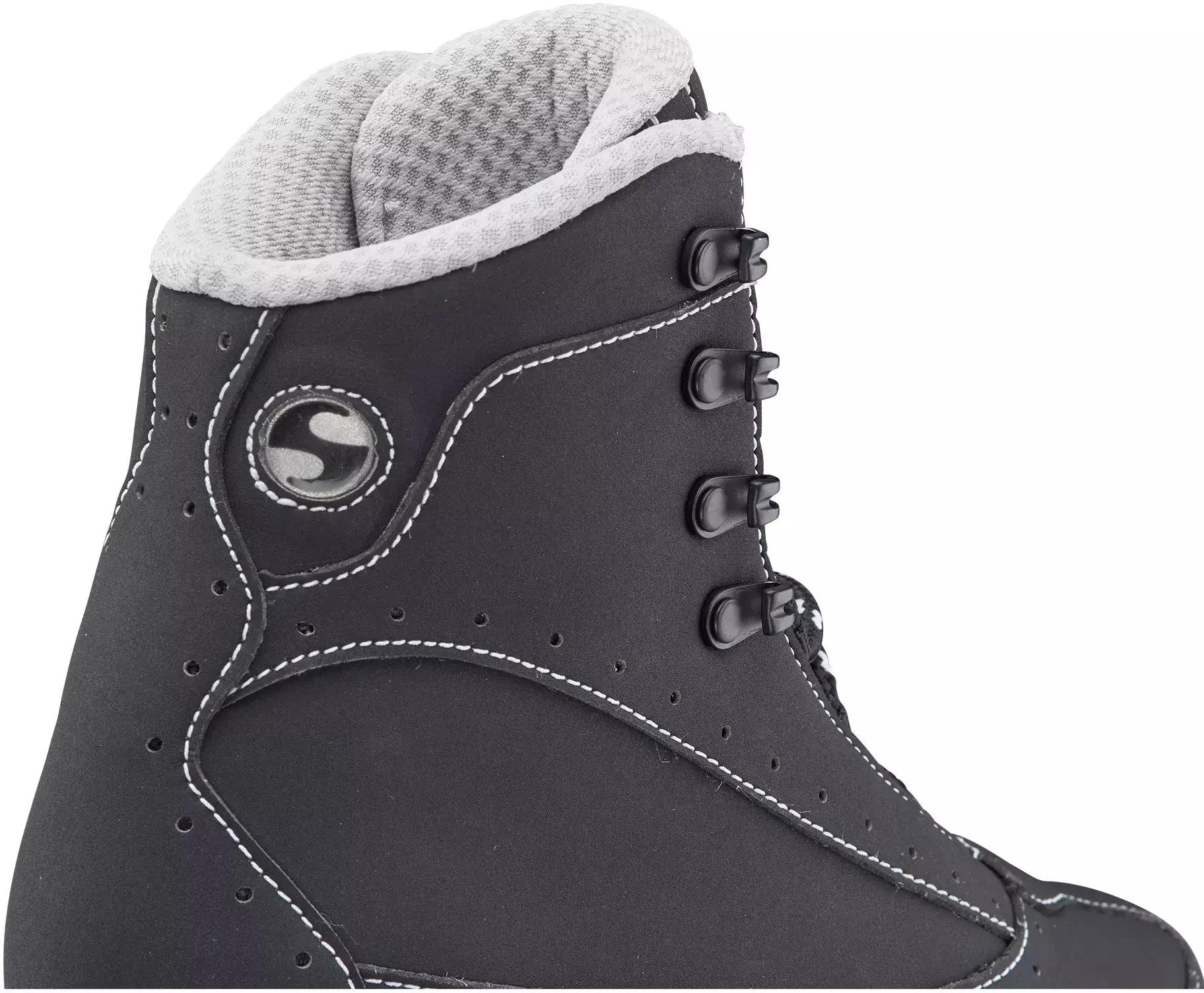 Close-up of the Softec Elite ST7200 lace hooks, round Softec badge and the fabric-lined rolled collar