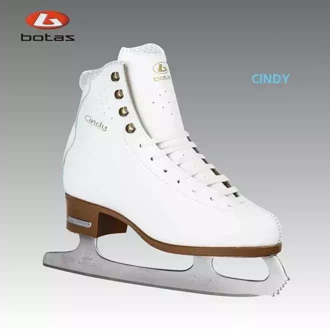 BOTAS Cindy Women’s and Girls’ Figure Skates 9 BOTAS Cindy white leather figure skate on a Botas branded background, showing the gold botas logo on the tongue